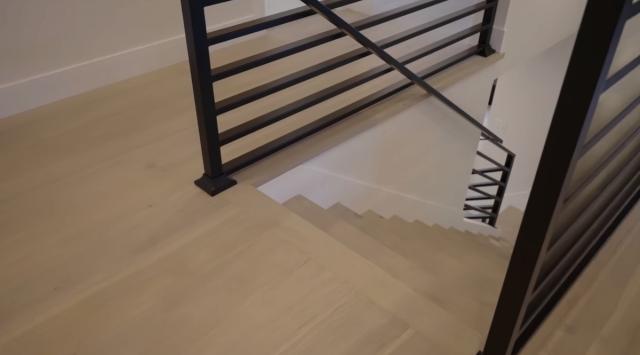 Modern Staircase Remodeling with Black Metal Railings