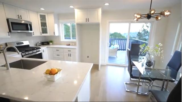 Bright Kitchen Remodeling with White Cabinets and Quartz Island